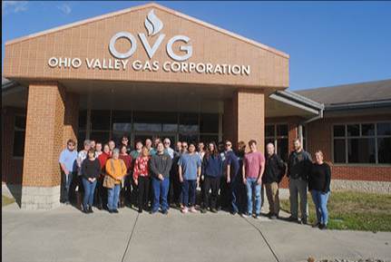 Group of students pose in front of Ohio Valley Gas Corporation building
